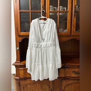 this is a cute, longsleeve, mini dress. looks and feels new. worn once.